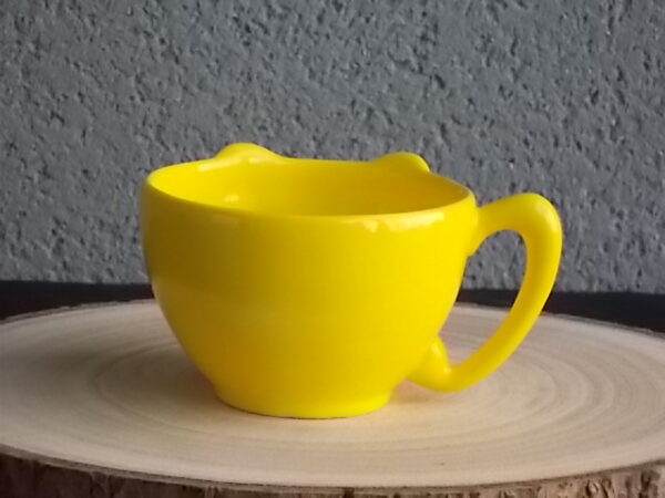 Tasse, en céramique Jaune, représentant le personnage de "Titi", de Warner Bros. Distribué par Tropico Diffusion